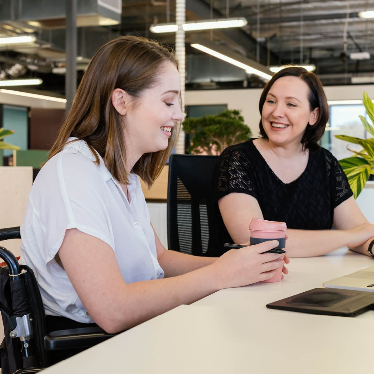 Women chatting at desk