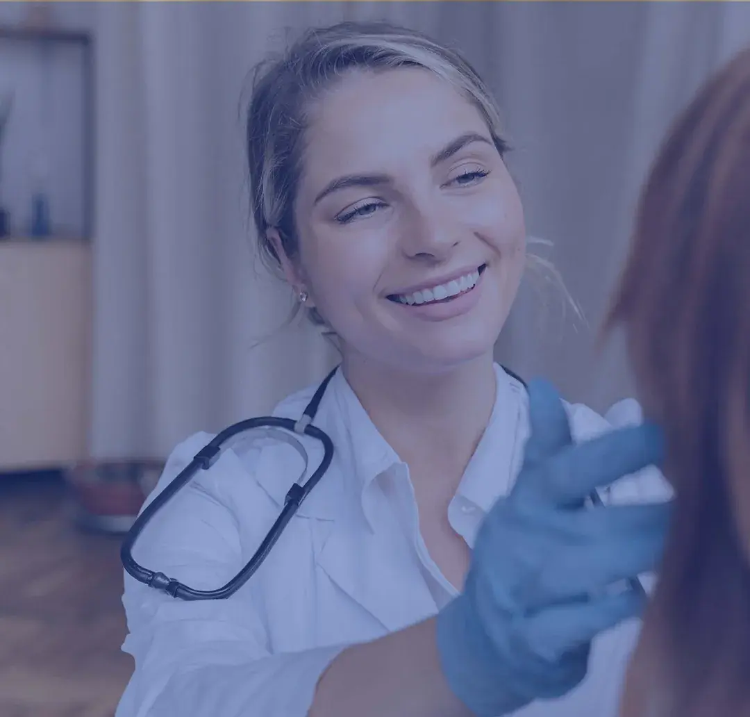 Young woman working in medical industry observing a patient