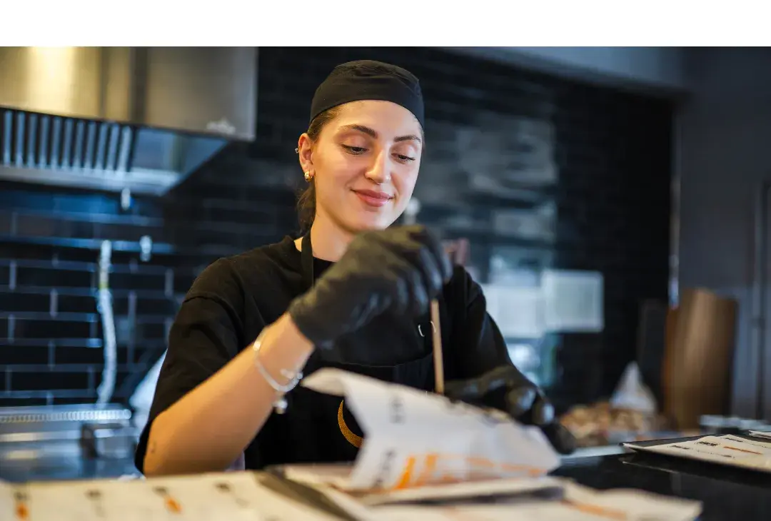 Female chef assembling food