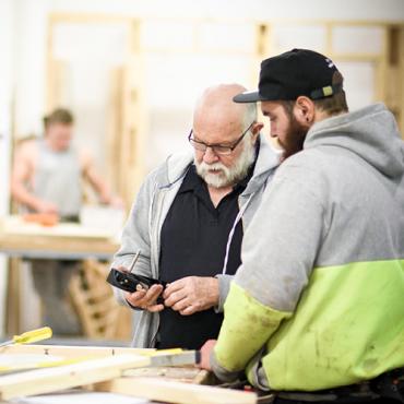 Apprentice being trained by his employer