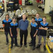Automotive apprentices with their employer