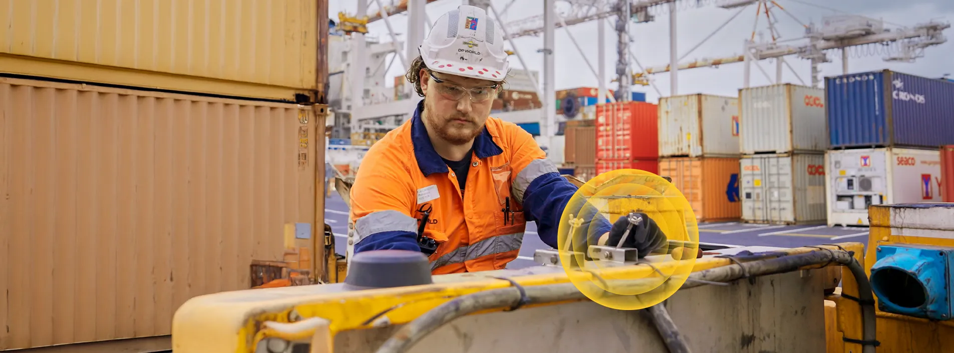 Electrical worker working on equipment outdoors
