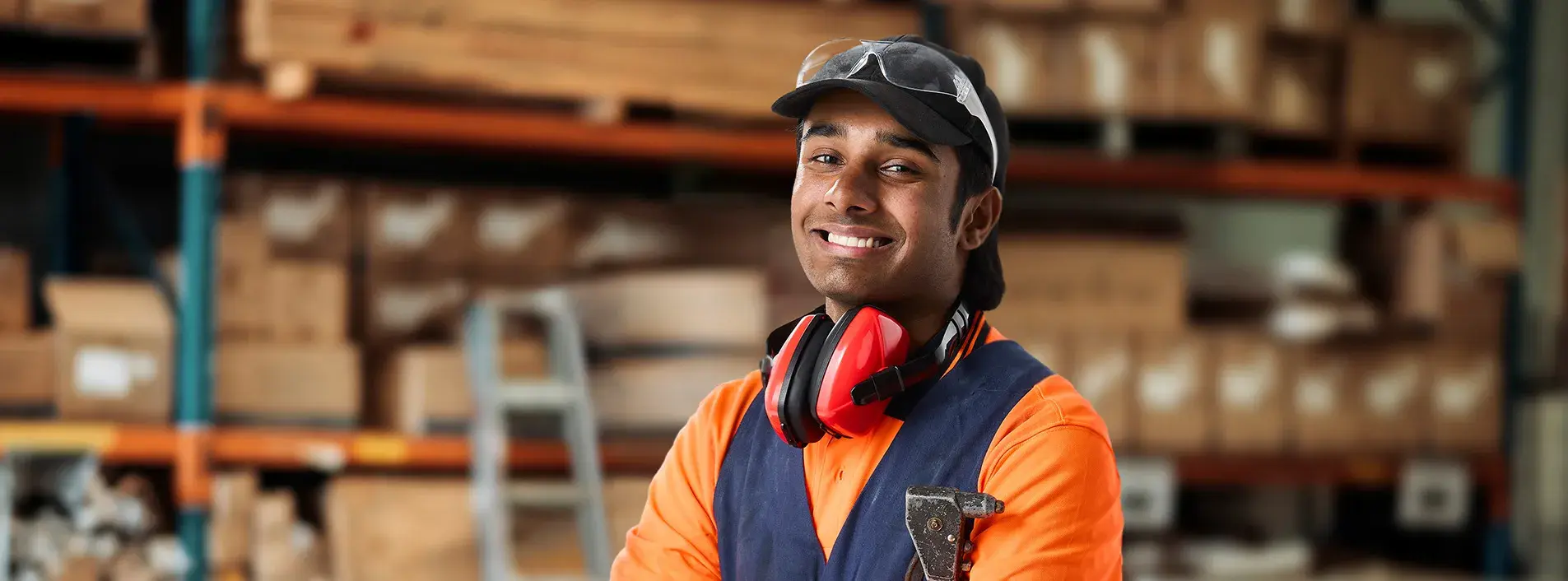 Young store hand wearing PPE in a warehouse